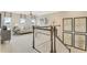 Bright, open loft space with modern lighting and artwork, creating a welcoming upper-level retreat at 6413 Clover St, Lake Hamilton, FL 33851