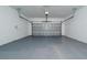 Spacious two car garage with white walls and sealed concrete floors at 6452 Sprucepine Ln, St Cloud, FL 34771