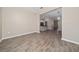 Open concept living area featuring view into kitchen and dining area, perfect for modern living at 6452 Sprucepine Ln, St Cloud, FL 34771