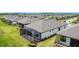 Aerial view of a backyard featuring a large screened-in lanai at 684 San Augusto Dr, Poinciana, FL 34759