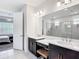 Bright bathroom features dual sinks, vanity, and modern fixtures at 684 San Augusto Dr, Poinciana, FL 34759