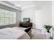 Bright bedroom features a large window and stylish dresser at 684 San Augusto Dr, Poinciana, FL 34759