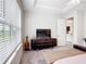 Bright bedroom features a large window and stylish dresser at 684 San Augusto Dr, Poinciana, FL 34759