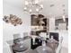 Dining area displays modern decor and connects to the kitchen with dark cabinets and white countertops at 684 San Augusto Dr, Poinciana, FL 34759