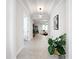 Spacious hallway featuring neutral walls, tile flooring, and views of multiple rooms, creating an open feel at 684 San Augusto Dr, Poinciana, FL 34759