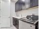 This laundry room features modern appliances, ample cabinet space, and a functional sink area at 684 San Augusto Dr, Poinciana, FL 34759