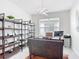 Bright office space features modern shelving, stylish light fixture and desk, perfect for a productive work environment at 684 San Augusto Dr, Poinciana, FL 34759