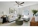 Cozy living room featuring stylish decor and a comfortable sectional sofa with decorative pillows at 725 Lake Dell Rd, Dundee, FL 33838