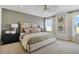 Relaxing main bedroom showcasing a well-appointed bed, soft lighting, and calming decor at 725 Lake Dell Rd, Dundee, FL 33838