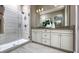 Elegant bathroom featuring a glass shower, double vanity, and modern fixtures at 730 Lake Dell Rd, Dundee, FL 33838
