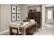 Inviting dining room with a wooden table set for a meal, alongside a cabinet and art at 730 Lake Dell Rd, Dundee, FL 33838
