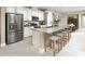Spacious kitchen with an island, stainless steel appliances, and a breakfast bar at 730 Lake Dell Rd, Dundee, FL 33838