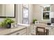Bright home office featuring custom built-ins, natural light, and a comfortable workspace at 730 Lake Dell Rd, Dundee, FL 33838