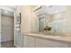 Bathroom featuring a double vanity, a glass shower, and neutral colors at 733 Lake Dell Rd, Dundee, FL 33838