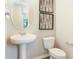 Cozy bathroom with modern decor, a stylish mirror, and a new toilet at 733 Lake Dell Rd, Dundee, FL 33838