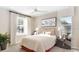 Inviting bedroom with large windows, modern decor, and ceiling fan at 733 Lake Dell Rd, Dundee, FL 33838