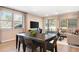 Bright living room featuring sleek floors, sliding glass doors and a casual seating arrangement at 733 Lake Dell Rd, Dundee, FL 33838