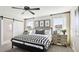 Cozy bedroom with a black frame bed, bedside tables, and decor for a peaceful rest at 737 Lake Dell Rd, Dundee, FL 33838