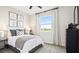 Serene bedroom with a comfortable bed, soft lighting, a large window, and tasteful decor at 737 Lake Dell Rd, Dundee, FL 33838