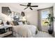 Well-lit bedroom with a comfortable bed, stylish decor, and a large window with scenic view at 737 Lake Dell Rd, Dundee, FL 33838