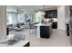 Inviting open-concept living room and kitchen with modern decor, a large window, and comfortable seating at 737 Lake Dell Rd, Dundee, FL 33838