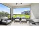 Relaxing patio with outdoor seating overlooking a serene pond and lush greenery at 737 Lake Dell Rd, Dundee, FL 33838