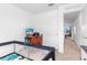Bright bedroom with a playpen, a window for natural light and a view, and neutral carpet at 740 Madison Dr, Davenport, FL 33837