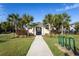Charming clubhouse nestled among palm trees, offering a welcoming community gathering space at 740 Madison Dr, Davenport, FL 33837