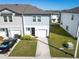 Attractive two-story home boasting a one-car garage, landscaped front yard, and charming curb appeal at 740 Madison Dr, Davenport, FL 33837