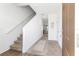 Inviting home hallway featuring a carpeted staircase and warm neutral tones at 740 Madison Dr, Davenport, FL 33837