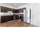 Well-equipped kitchen features granite countertops, stainless steel appliances, and ample cabinet space at 740 Madison Dr, Davenport, FL 33837
