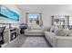 Comfortable living area features a large sectional sofa, modern decor, and a serene, inviting ambiance at 740 Madison Dr, Davenport, FL 33837