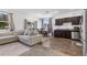 Open-concept living area featuring modern furnishings, natural light, and a dining area adjacent to the kitchen at 740 Madison Dr, Davenport, FL 33837