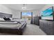 Spacious main bedroom with a four-poster bed, carpet, and natural light from the window at 740 Madison Dr, Davenport, FL 33837