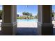 View of a refreshing community pool area with lounge chairs and clear blue water at 740 Madison Dr, Davenport, FL 33837