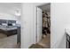 View into walk-in closet from the bedroom with ample storage space for clothing at 740 Madison Dr, Davenport, FL 33837