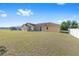 Large backyard with a spacious lawn, offering potential for various outdoor activities at 7431 Sw 129Th Pl, Ocala, FL 34473
