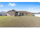 Expansive backyard featuring well-maintained grass, providing ample space for outdoor activities and relaxation at 7431 Sw 129Th Pl, Ocala, FL 34473