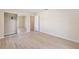 Bright bedroom with wood floors, a closet with mirrored doors, and neutral paint at 7431 Sw 129Th Pl, Ocala, FL 34473