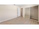 Bright bedroom with hardwood floors and a mirrored closet with ample storage at 7431 Sw 129Th Pl, Ocala, FL 34473