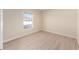 Cozy bedroom with a neutral color scheme and a window to let in natural light at 7431 Sw 129Th Pl, Ocala, FL 34473