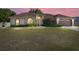 Charming one-story home with meticulously maintained front lawn and landscaping at 7431 Sw 129Th Pl, Ocala, FL 34473
