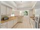 Well-maintained kitchen features stainless steel appliances, ample cabinetry, and a breakfast bar at 7431 Sw 129Th Pl, Ocala, FL 34473