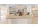 Open kitchen design with stainless steel appliances, generous counter space, and a breakfast bar for casual dining at 7431 Sw 129Th Pl, Ocala, FL 34473