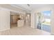Bright and airy living room with light wood floors and a large sliding glass door at 7431 Sw 129Th Pl, Ocala, FL 34473