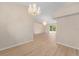 Inviting living space featuring modern floors, neutral walls, vaulted ceiling, and ample space for entertaining at 7431 Sw 129Th Pl, Ocala, FL 34473
