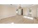 Main bedroom featuring a chandelier, neutral walls, and an en suite bathroom at 7431 Sw 129Th Pl, Ocala, FL 34473