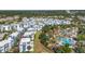 Primary-planned community showcases resort-style pool, golf course, and modern townhomes amid mature landscaping at 7740 Sandy Ridge Dr # 236, Reunion, FL 34747