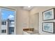 Bright bathroom with a large mirror, a white vanity, and modern fixtures, creating a clean and inviting space at 7740 Sandy Ridge Dr # 236, Reunion, FL 34747