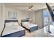Bedroom with two beds, and a window offering natural light at 7740 Sandy Ridge Dr # 236, Reunion, FL 34747